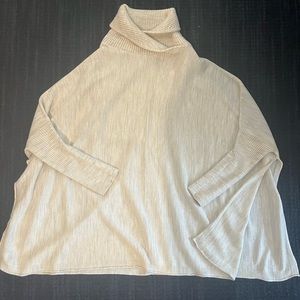 Mersea cream poncho with vented sides